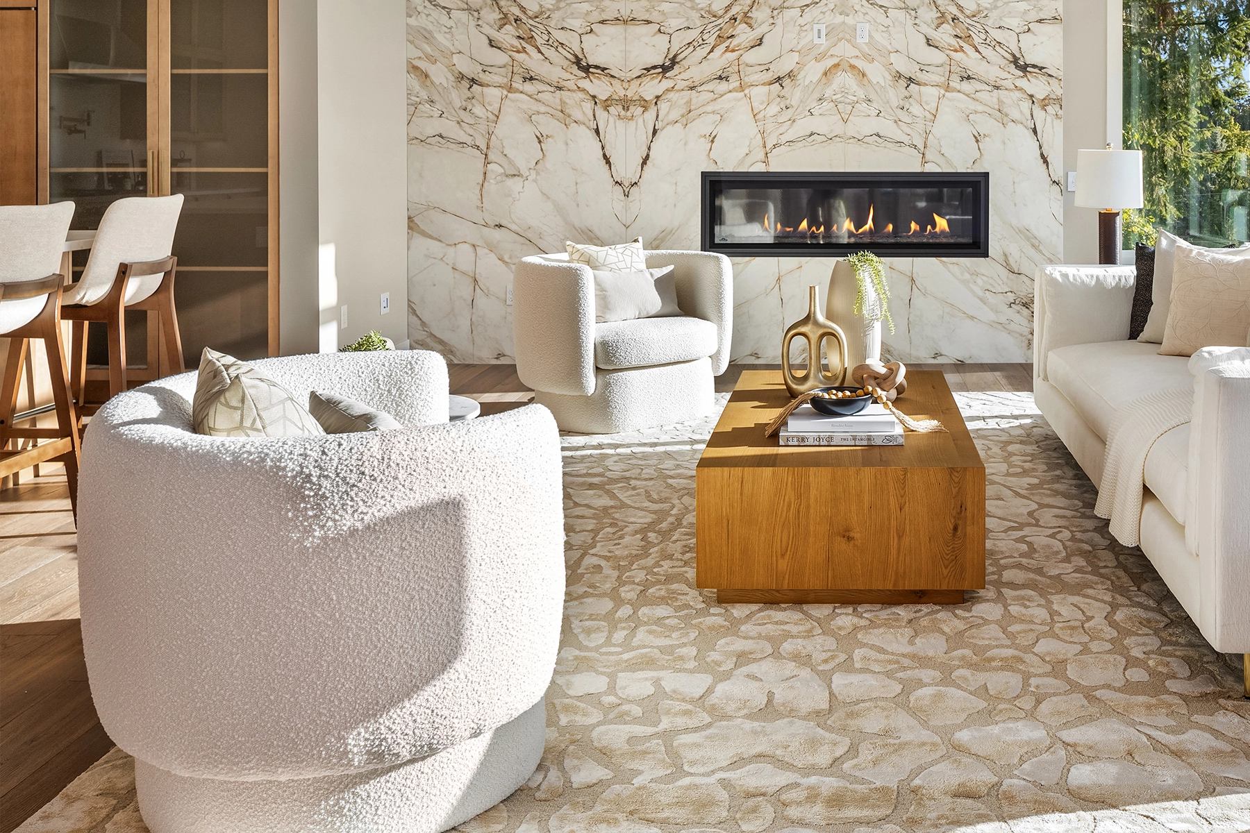 Stylish modern living room featuring a cozy fireplace, elegant decor, and natural light for an eastside architecture and interior design project.