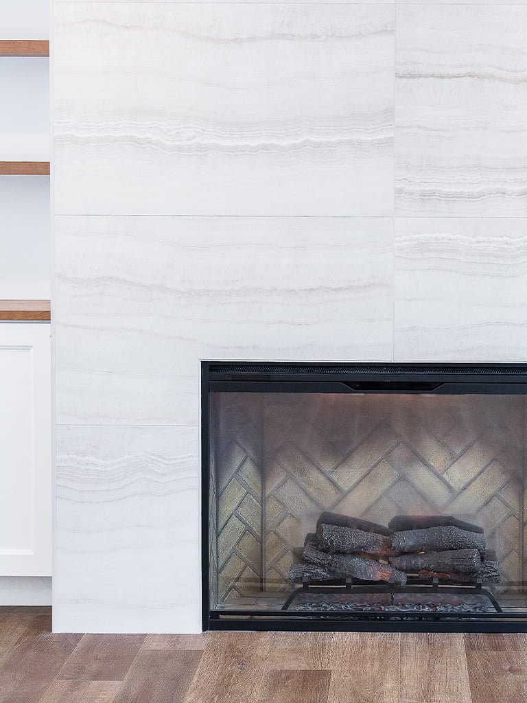 Modern living room with stone fireplace wall — Kirkland Home, Ariana Designs