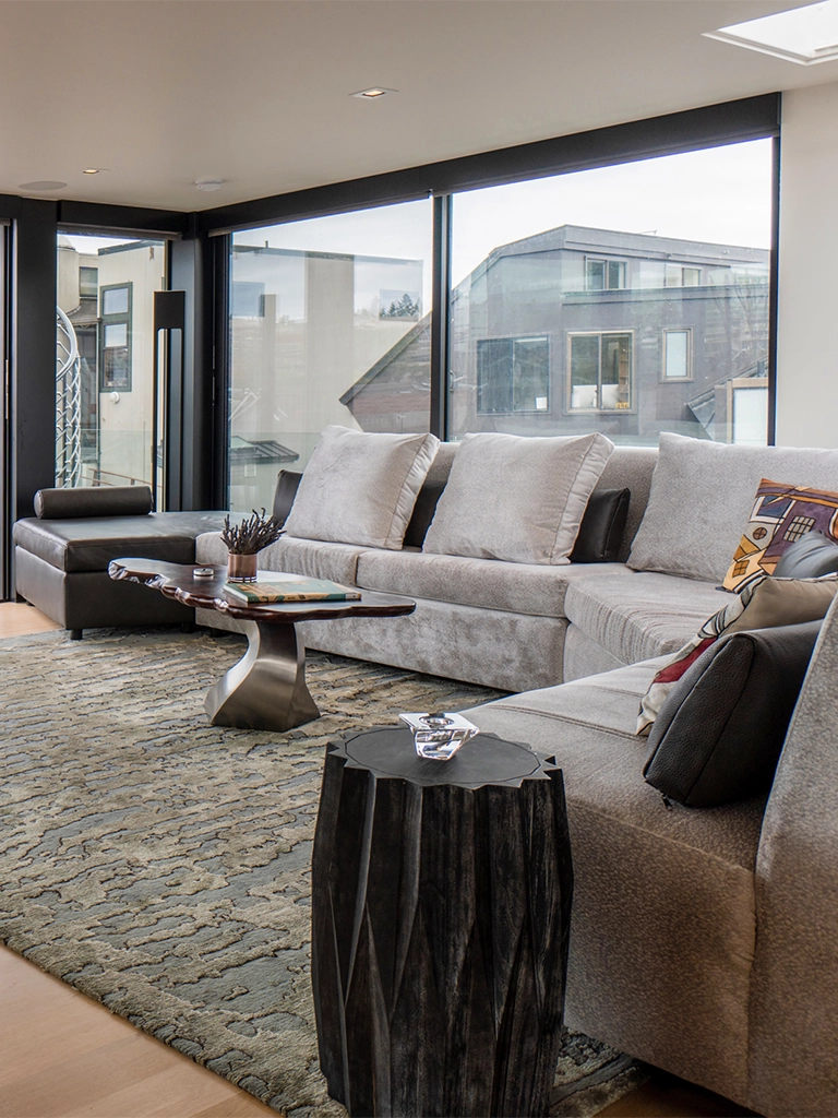 Modern living room light gray sofa panoramic urban views — Ariana Designs, Seattle floating home