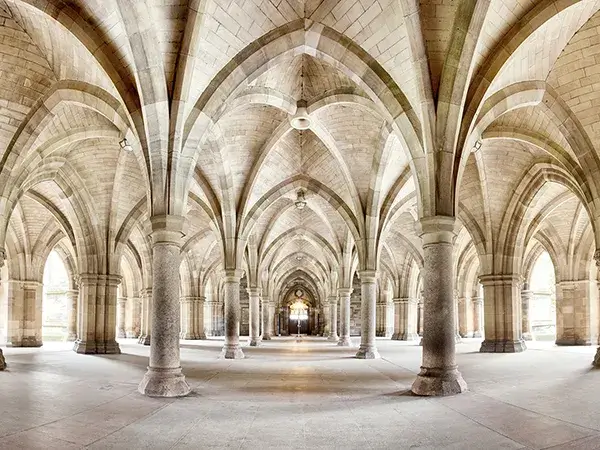 Gothic architecture design highlights Glasgow Universitys cloisters with intricate arches and elegant columns.