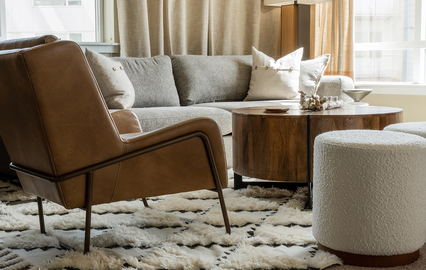 Living room with brass accents and natural light — Ariana Designs