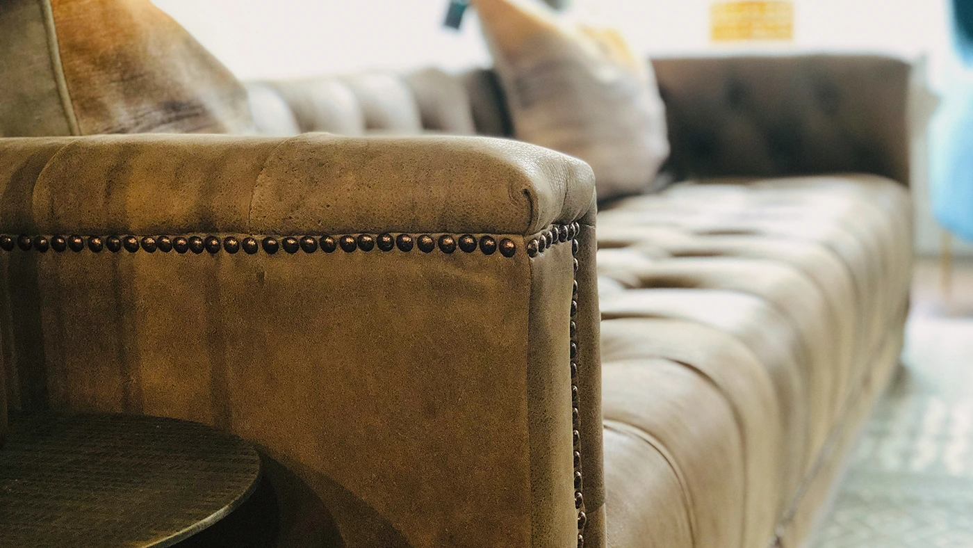 Luxury tufted leather sofa elegant interior — Ariana Designs, Sumner Washington