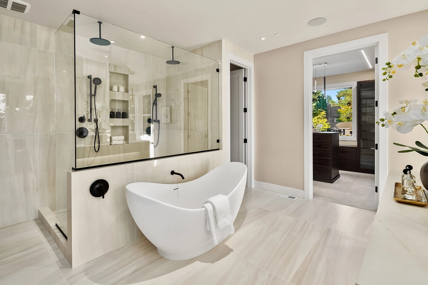 Master bath with marble accents and considered lighting