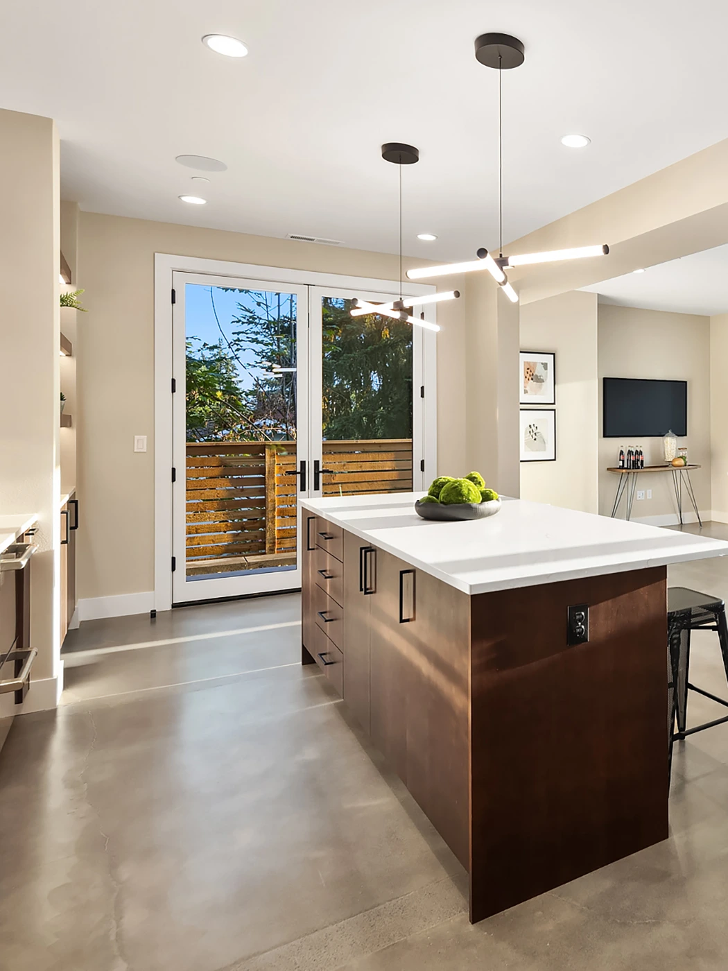 Modern bright bar interior with sleek island and warm wood cabinetry — Medina, Ariana Designs