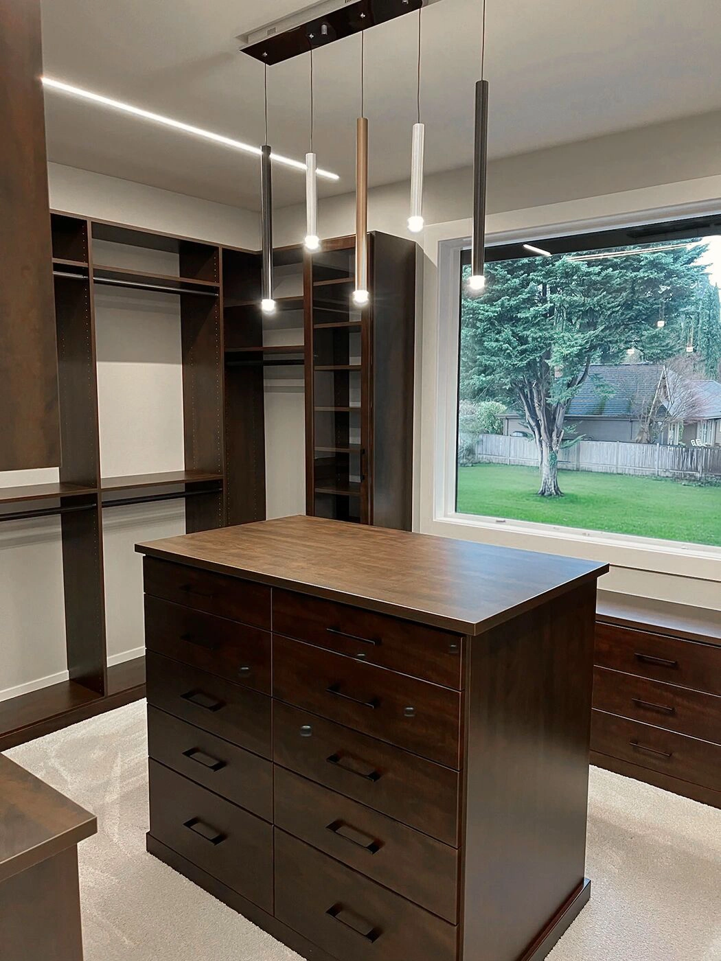 Custom closet design with dark wood cabinetry — Medina Master Suite, Ariana Designs