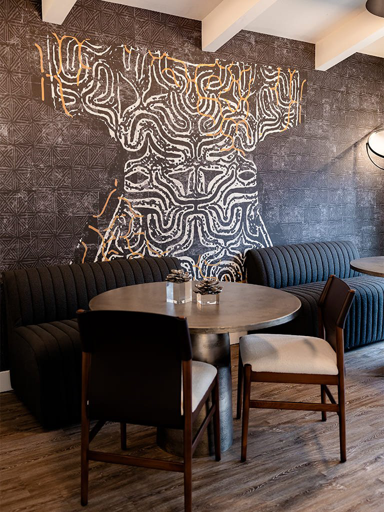 Dining space with artistic mural — Commercial Interior, Ariana Designs