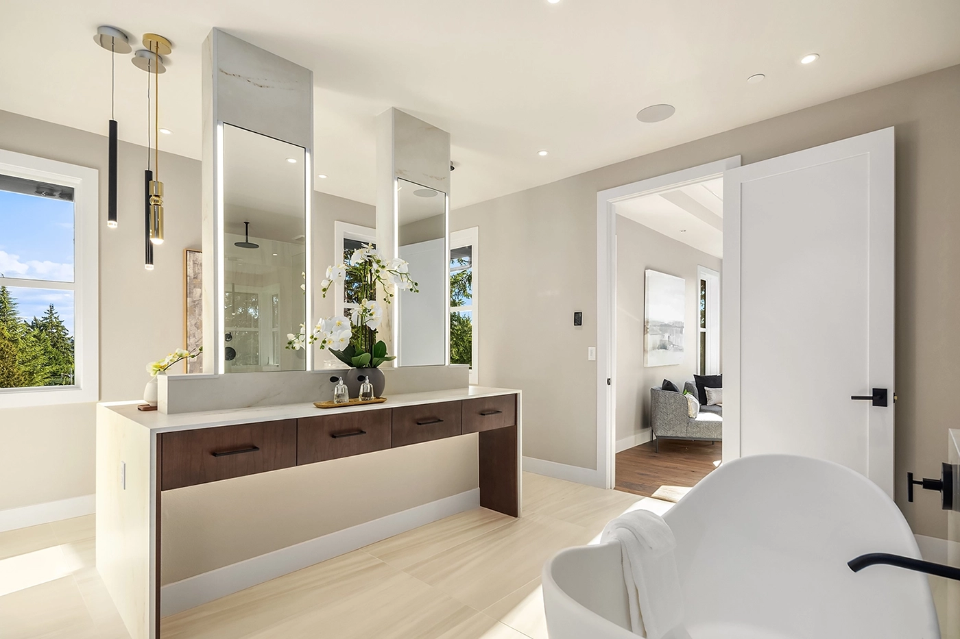 Elegant bathroom with sculptural freestanding tub — Ariana Designs