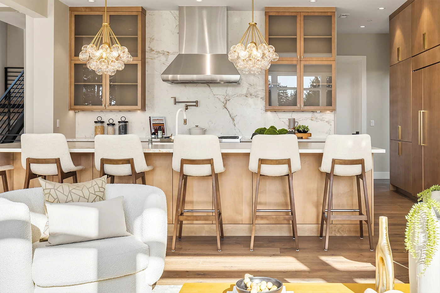 Elegant kitchen with island and cozy seating area — Medina kitchen design, Ariana Designs