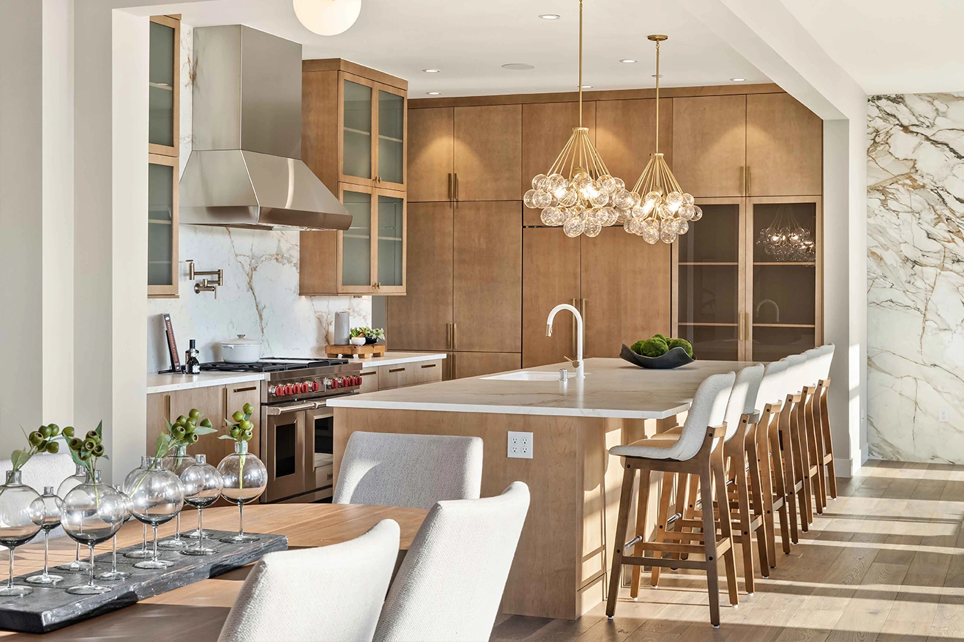 Elegant modern kitchen with stylish island and marble accents — Medina, Ariana Designs