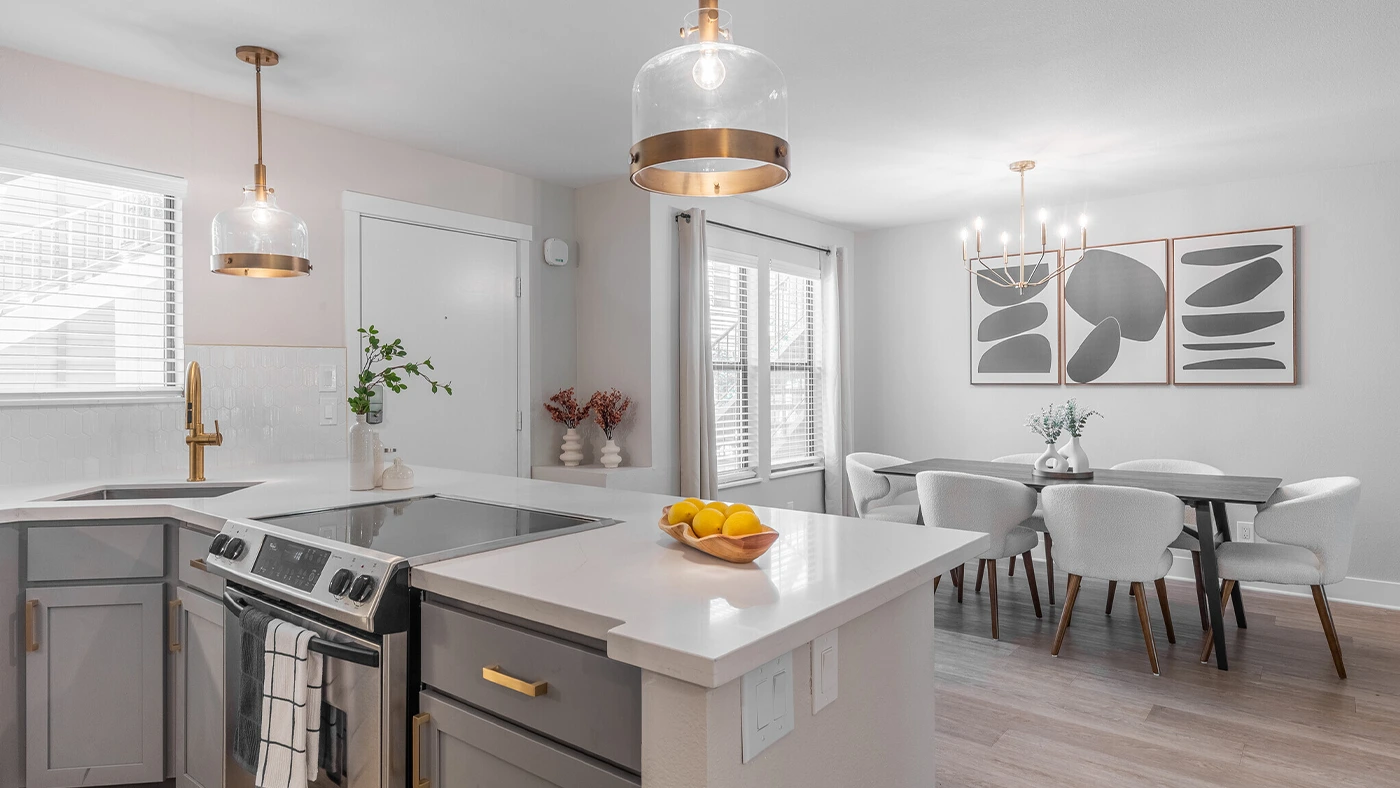 Kitchen dining area with gold chandelier — One Jefferson Model Unit, Ariana Designs