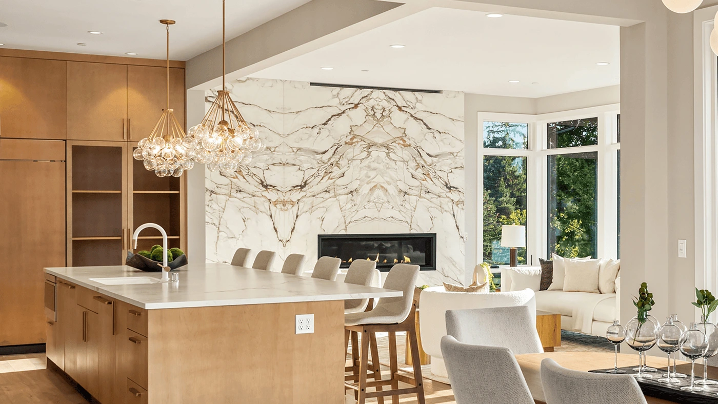Modern kitchen and living space with fireplace statement wall — Ariana Designs, Bellevue