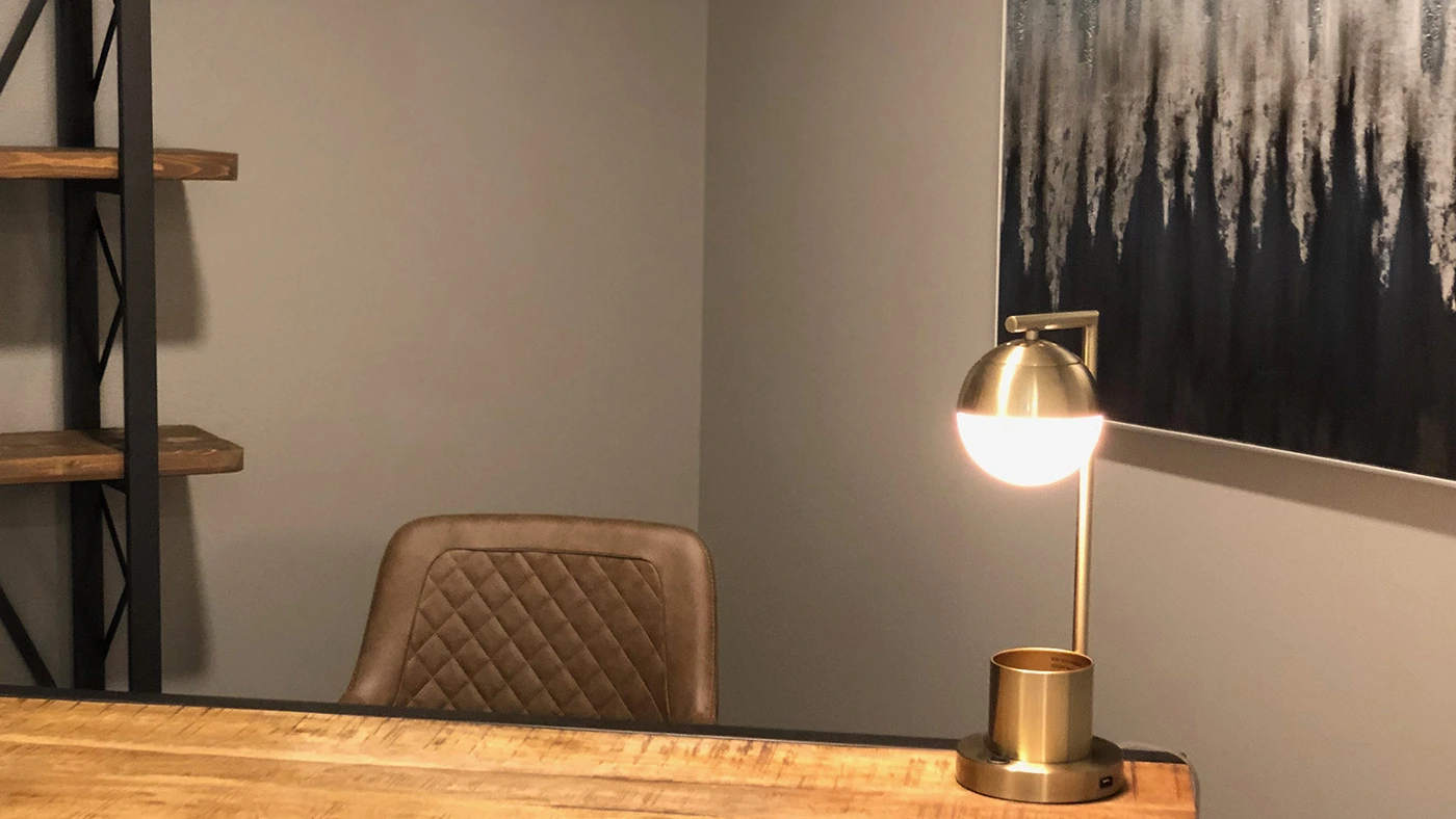 Cozy modern office wooden desk sleek chair decorative shelving — Ariana Designs, Sumner Washington