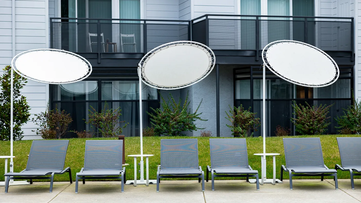 Modern outdoor lounge chairs canopies poolside — Ariana Designs, Bellevue Washington