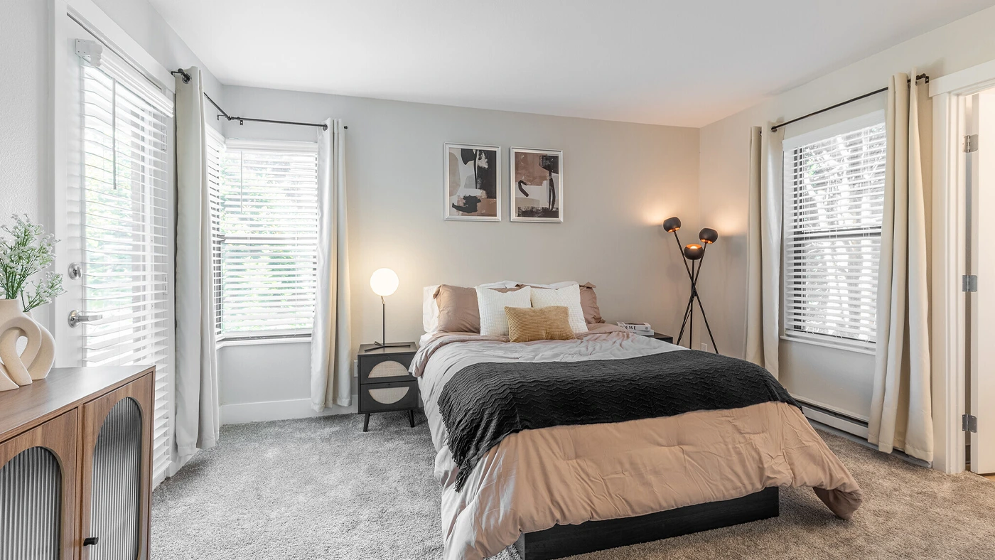 Serene primary bedroom with neutral palette — One Jefferson Model Unit, Ariana Designs