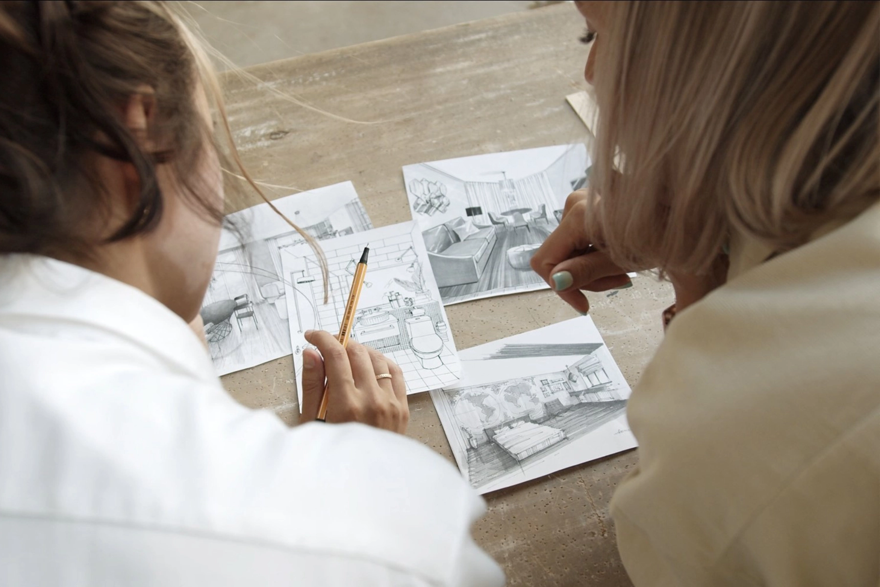 Interior designer discussing ideas with a client during a consultation session at Ariana Designs and Architecture.