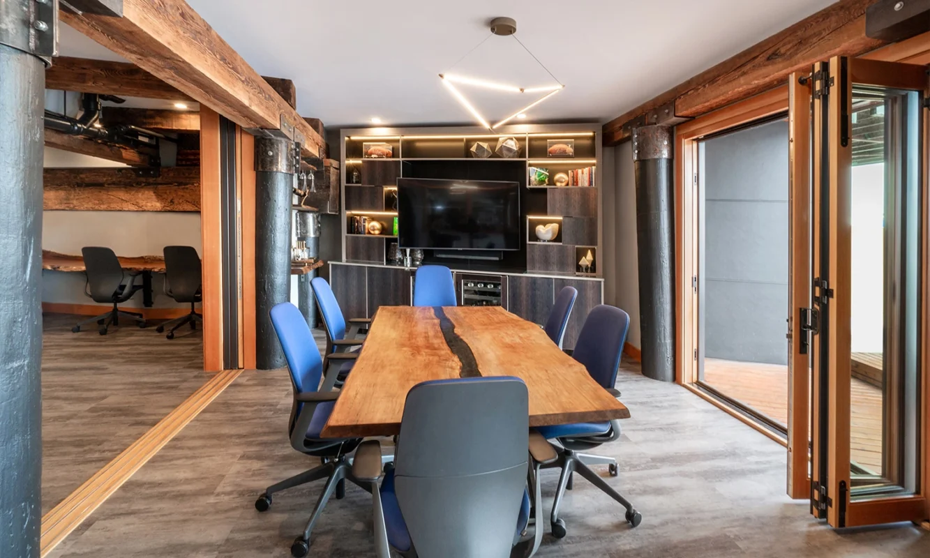 Multi-functional home workspace combining an office area and living space, demonstrating innovative design solutions for remote work.