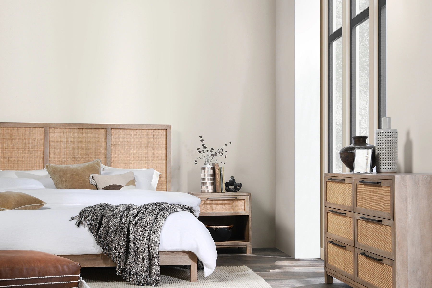 Stylishly staged bedroom designed by an interior designer, highlighting elegant furnishings and a serene, inviting atmosphere.