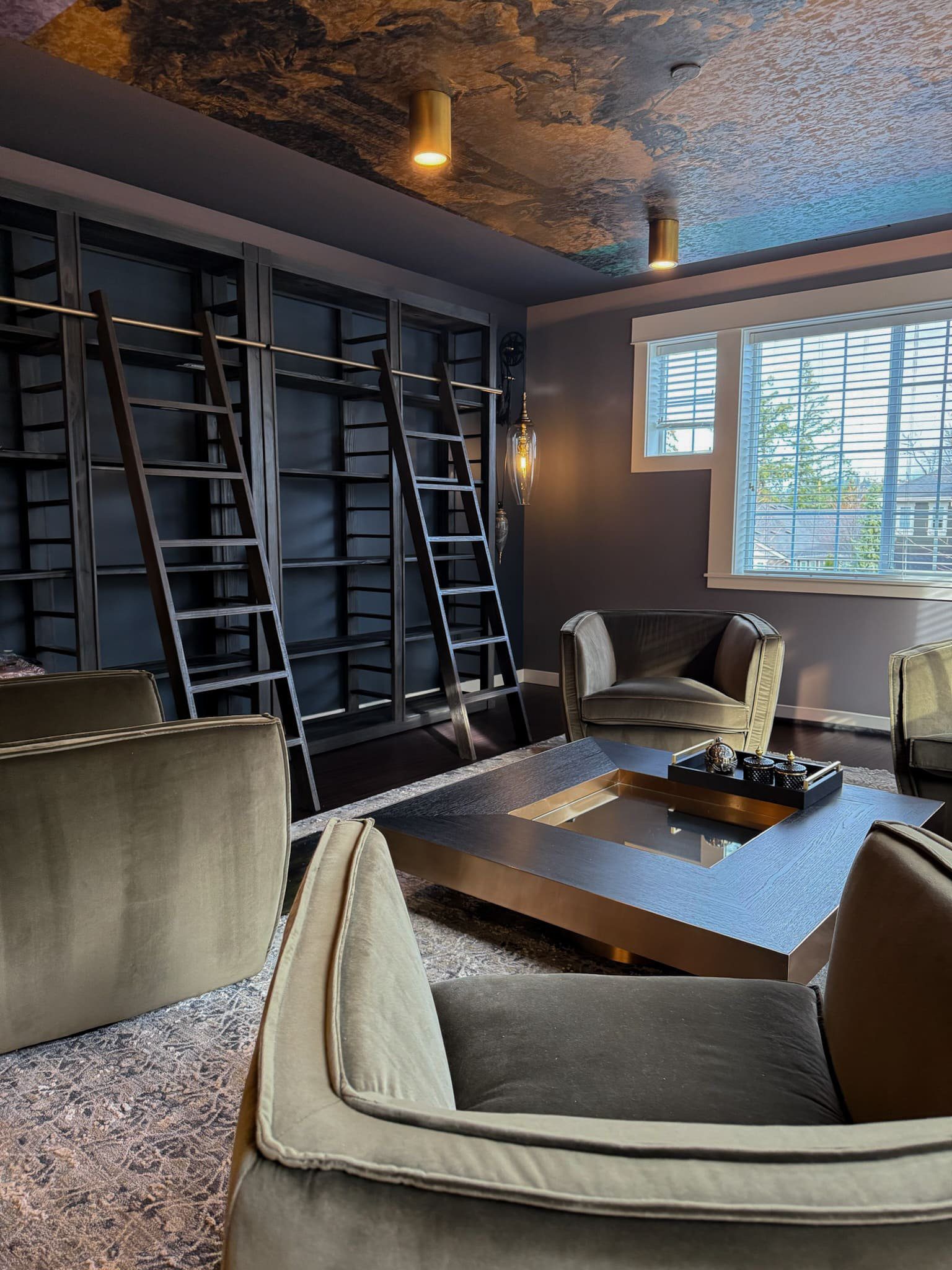 Chic modern lounge with plush seating and elegant lighting — Kirkland home library